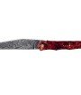 Ce couteau de Laguiole Tribal pliant est doté d'un plein manche de 12 cm en loupe d'erable négundo stabilisé, de platines guillochées et monté avec une lame damas carbone.